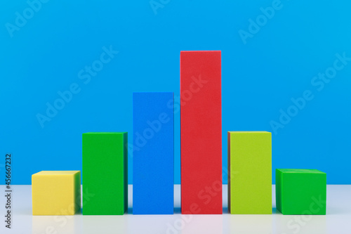 Business concept. Multicolored graph diagram with rise and fall dynamic against blue background. Chart marketing, annual or corporate report, sales or growth evaluation or analytic or profit growing Free Download Business concept. Multicolored graph diagram with rise and fall dynamic against blue background. Chart marketing, annual or corporate report, sales or growth evaluation or analytic or profit growing - GFXLoad
