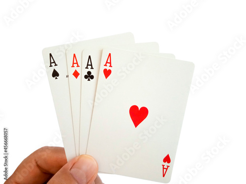 A man is holding of four aces cards, isolated on white background