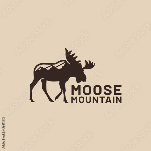 Moose Deer Silhouette with Mountain Logo Design Template. Suitable for hunting outdoor camping adventure sports zoo corporate community business brand in vintage retro hipster style logo design.