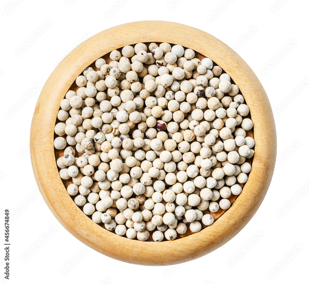 Dried white pepper seed in wooden dish isolated on white background. Dried white pepper seed in wooden dish isolated on white background.