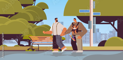 male parents walking outdoor with little child gay family transgender love LGBT community concept