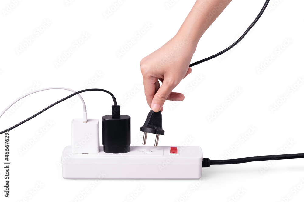 extension power strip with hand holding plug on white background. Saving energy and power, safety dangerous concept extension power strip with hand holding plug on white background. Saving energy and power, safety dangerous concept