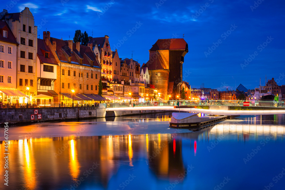 Beautiful architecture of the Main Town of Gdansk by the Motlawa River at night. Poland