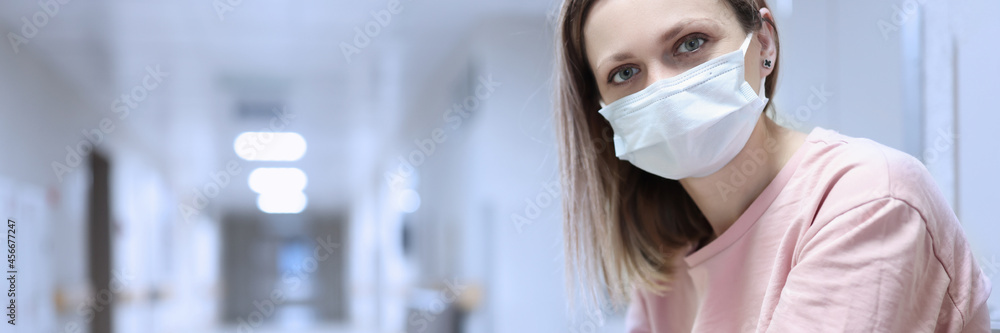 Portrait of woman in protective medical mask in corridor of t hospital Portrait of woman in protective medical mask in corridor of t hospital