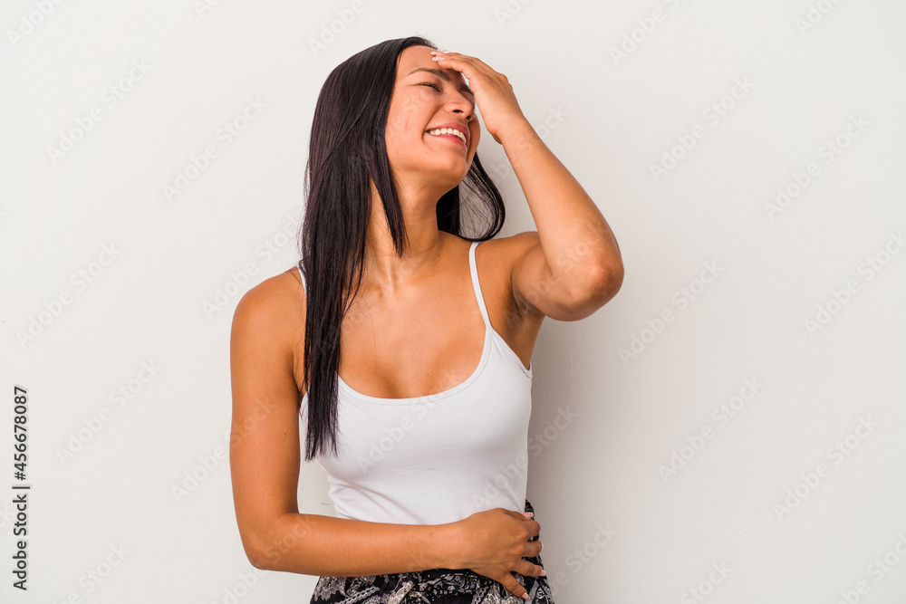 Young latin woman isolated on white background laughing happy, carefree, natural emotion. Young latin woman isolated on white background laughing happy, carefree, natural emotion.