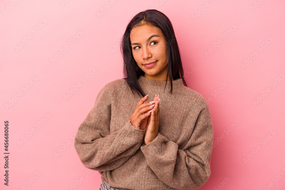 Young latin woman isolated on pink background making up plan in mind, setting up an idea. Young latin woman isolated on pink background making up plan in mind, setting up an idea.
