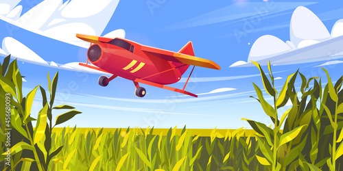 Crop duster plane flying over green corn field, farm airplane in blue cloudy sky. Agricultural cropduster machine spraying pesticides on meadow, farming aircraft, aviation, Cartoon vector illustration