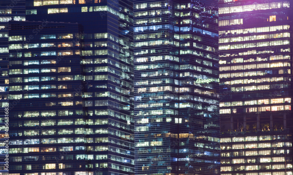 skyscrapers windows at night in Singapore skyscrapers windows at night in Singapore