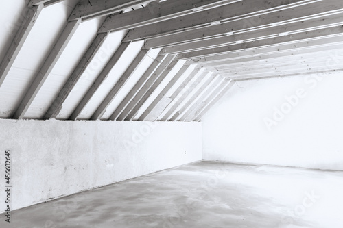 Building Attic Interior. Unfinished private dwelling house. Wooden Roof Frame House Construction. Black and white photo.