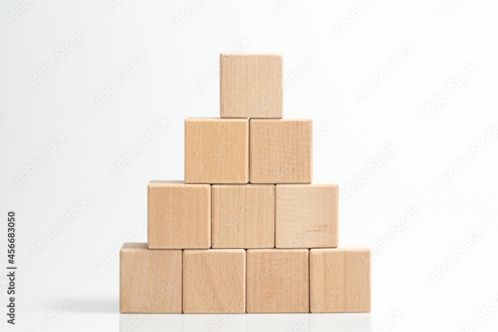 Obraz premium Pyramid of ten wooden cubes, on white background