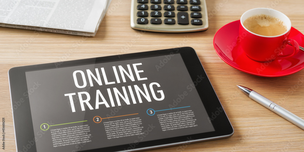 A tablet on a desk with the headline Online Training