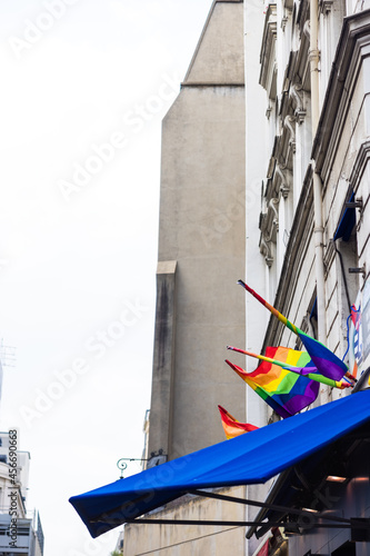 Beautiful shot of LGBTQ flags on a street building photo