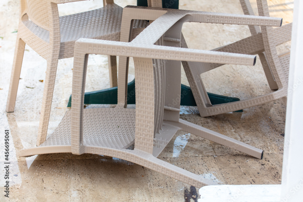 Thatched chairs in a cafe after tornado. Thatched chairs in a cafe after tornado.