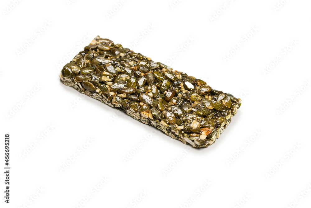 Bar with nuts isolated on a white background. Pumpkin seeds bar. Bar with nuts isolated on a white background. Pumpkin seeds bar.