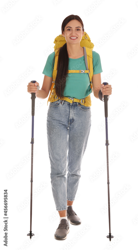 Female hiker with backpack and trekking poles on white background Female hiker with backpack and trekking poles on white background