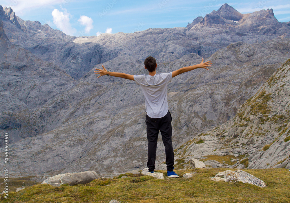 Carefree traveler enjoying freedom in mountains Carefree traveler enjoying freedom in mountains