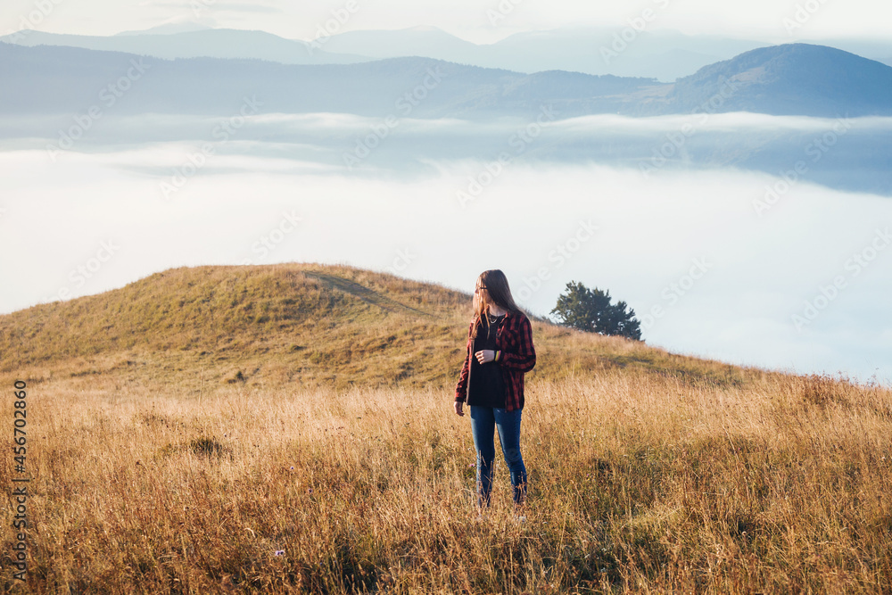 Young Girl in Foggy Mountain Landscape
