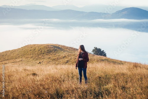 Young Girl in Foggy Mountain Landscape 