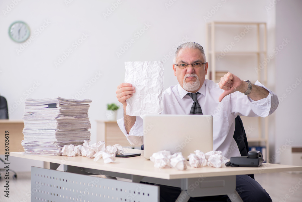 Old male employee in brainstorming concept Old male employee in brainstorming concept