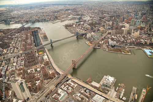 Brooklyn and Manhattan Bridges aerial view from helicopter  New York City. City skyline from a high vantage point - NY - USA.