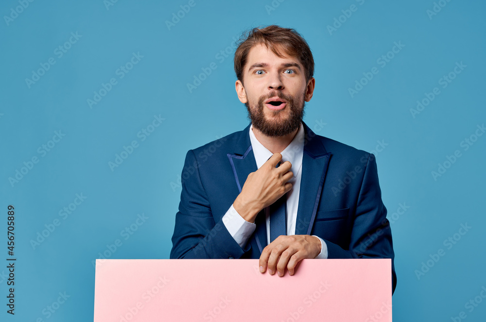 businessmen pink mockup poster in hand blue background businessmen pink mockup poster in hand blue background