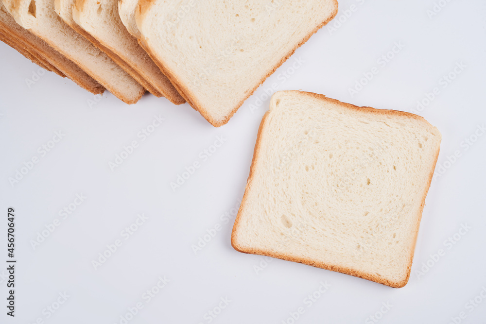 Square slices of toast sandwich bread isolated on white background close up Square slices of toast sandwich bread isolated on white background close up