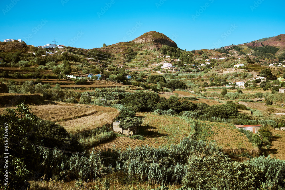 Mountain landscape with farm fields and small houses