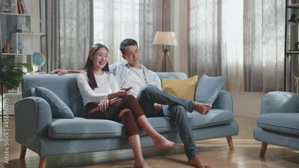 Young Asian Couple Relaxing And Watching Tv At Home
Young Asian Couple Relaxing And Watching Tv At Home