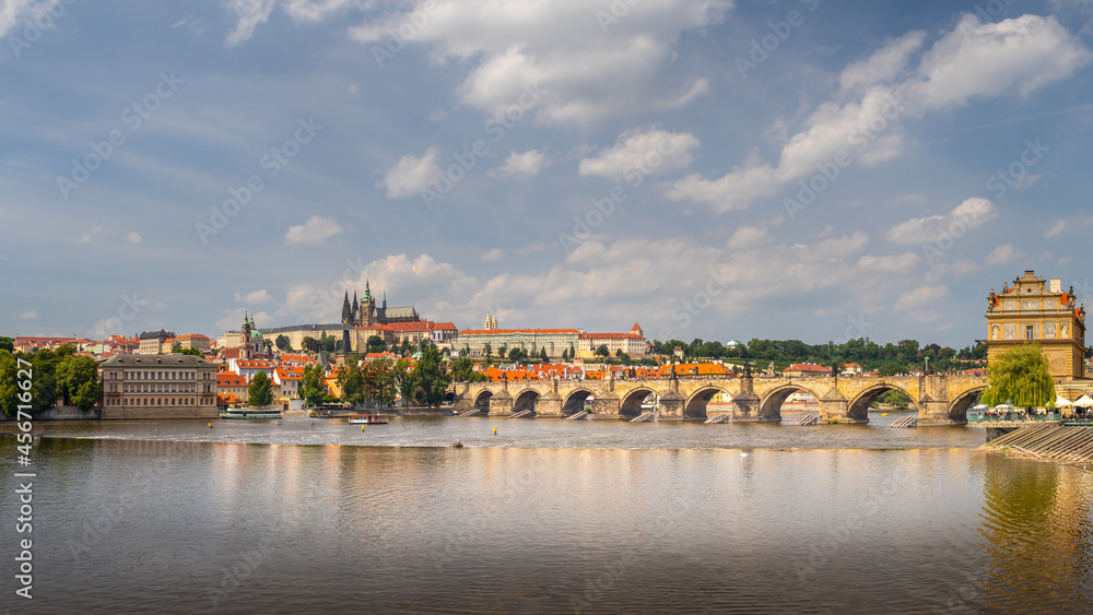 waterfront view across the river Vltava to Prague Castle and Charles Bridge, Prague, Czech republic