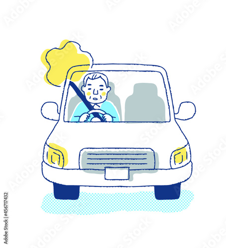 車の運転中にぼんやりしているシニア男性