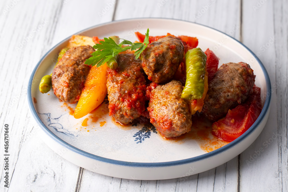 Traditional Homemade Turkish Food Kofte - Kofta with Tomato Sauce and Potatoes. (Turkish name; Izmir kofte) Traditional Homemade Turkish Food Kofte - Kofta with Tomato Sauce and Potatoes. (Turkish name; Izmir kofte)