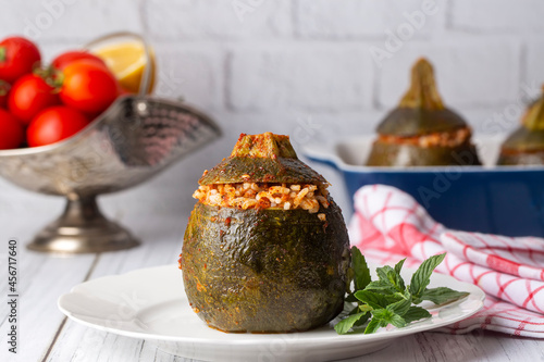 Zucchini stuffed with meat, rice and vegetables. Traditional delicious Turkish food, mini ball stuffed zucchini (Turkish name; top kabak dolmasi) photo