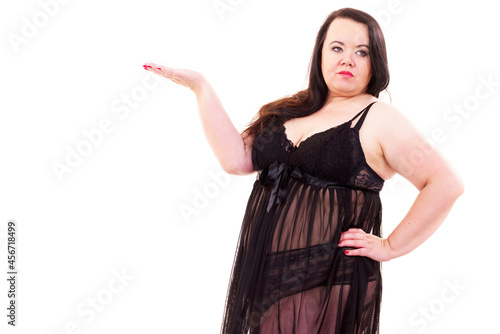 Woman plus size in lingerie holds open hand