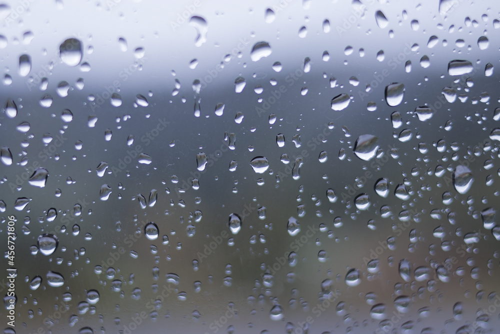 Defocused abstract background of raindrops on windshield car after rain Defocused abstract background of raindrops on windshield car after rain