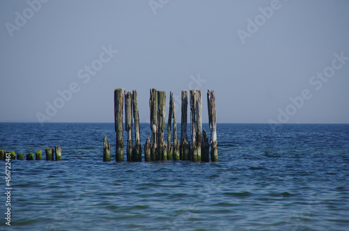 Old wooden breakwater by the sea - rusty water coastal protection © Skórzewiak