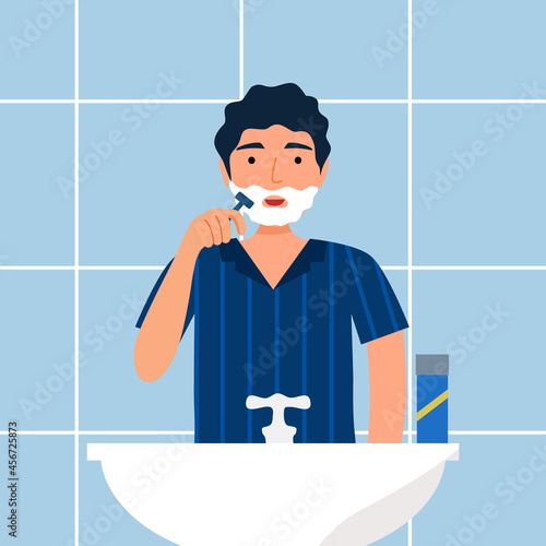 Young man shaving foam with razor in flat design. Guy shave beard in the restroom.