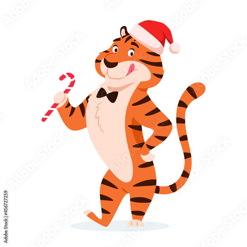 Cartoon happy tiger in Santa hat with Christmas candy cane isolated on white background. Cute licking wild cat. Chinese symbol of New Year 2022. Holiday standing striped character vector illustration.