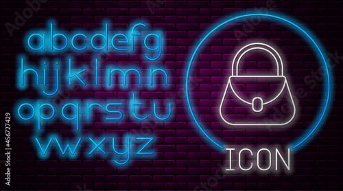 Glowing neon line Handbag icon isolated on brick wall background. Female handbag sign. Glamour casual baggage symbol. Neon light alphabet. Vector Illustration