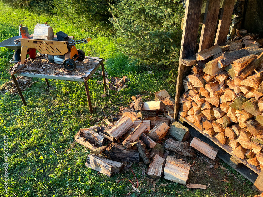 Fototapeta premium Firewood is split with a log splitter