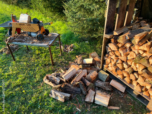 Firewood is split with a log splitter photo