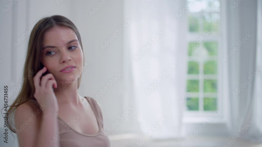 Girl hears the phone ringing. close-up shot lady in interior, takes the phone and speaks Girl hears the phone ringing. close-up shot lady in interior, takes the phone and speaks