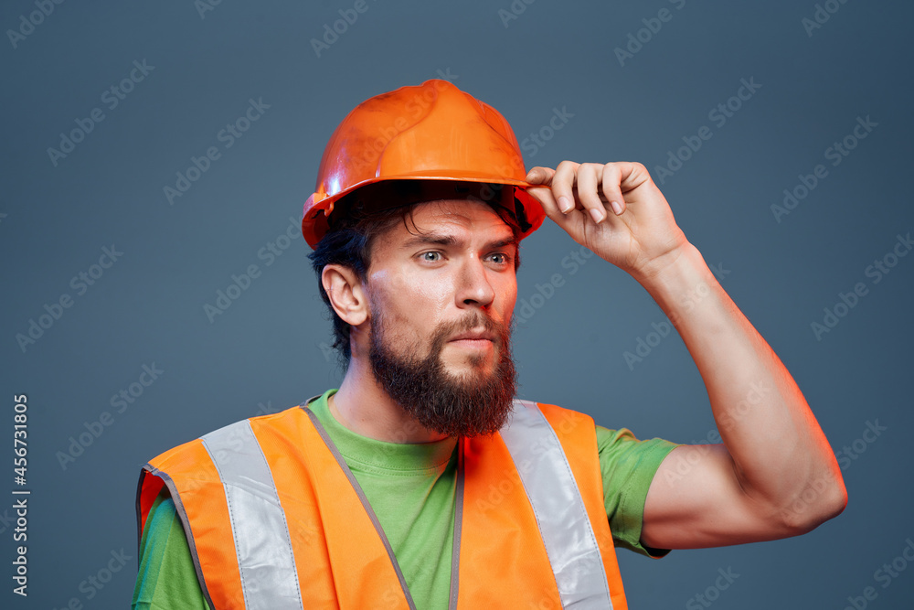 man in orange hard hat construction safety professional work
