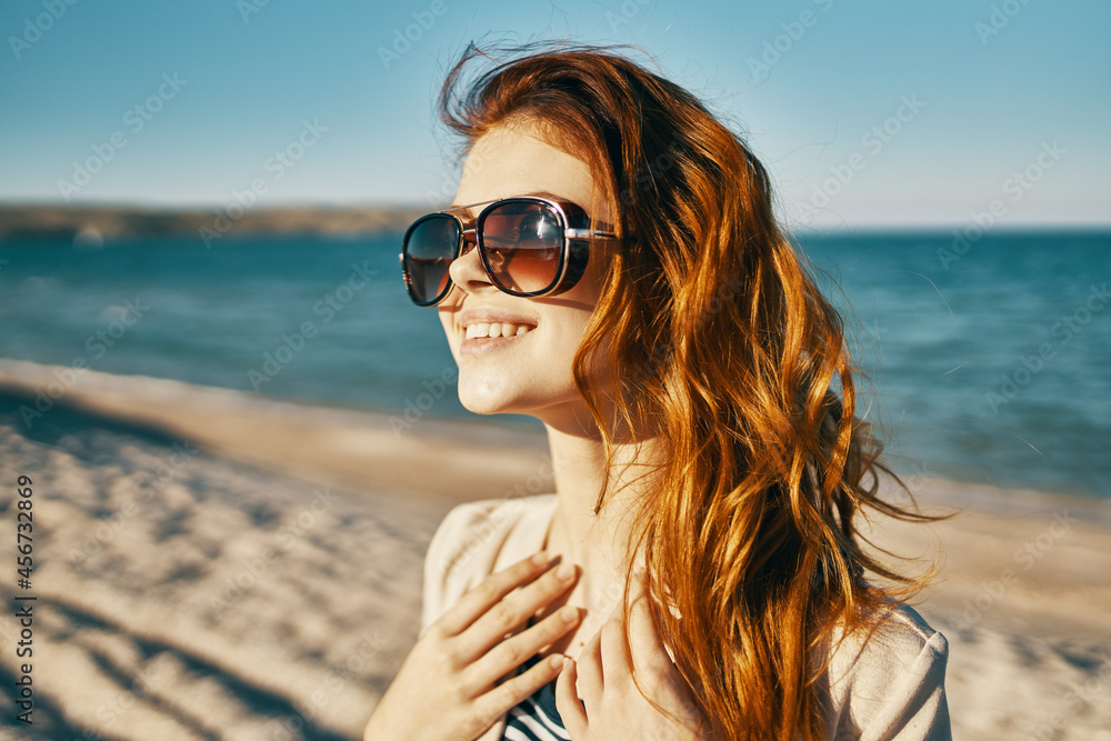 woman wearing sunglasses rocks landscape sea woman wearing sunglasses rocks landscape sea