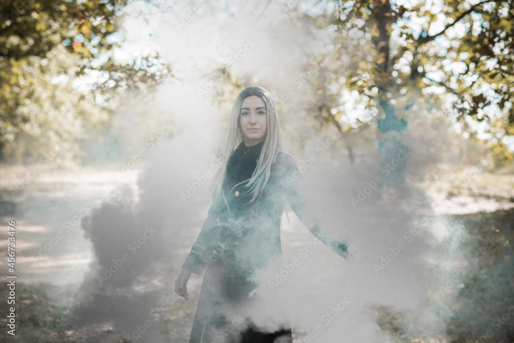 Fototapeta premium Mystical Halloween party and masquerade ideas, people outfits, scene in the forest