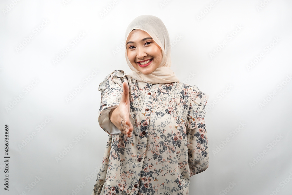 Beautiful young asian muslim woman smiling confidently, with hands ...