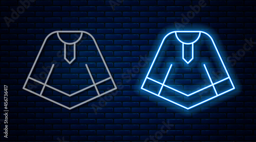 Glowing neon line Traditional mexican poncho clothing icon isolated on brick wall background. Vector