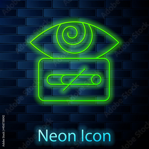 Glowing neon line Hypnosis icon isolated on brick wall background. Human eye with spiral hypnotic iris. Vector