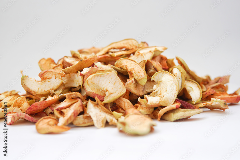 Homemade dried organic apple sliced on wood background