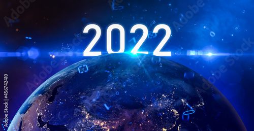 New year 2022 or start straight concept.word 2022 written on the galaxy,digital number and Global world network and telecommunication on earth.Elements of this image furnished by NASA