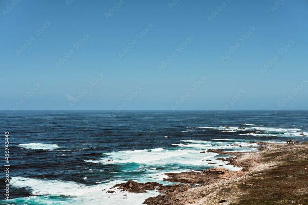 Rough sea landscape with rocks on the shore Rough sea landscape with rocks on the shore